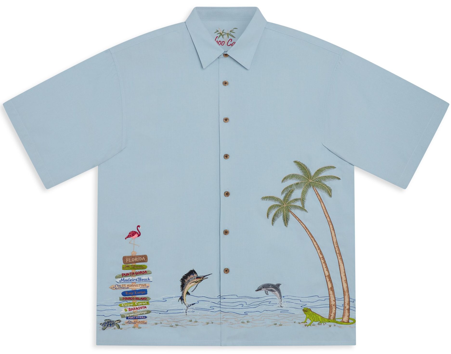 Men's chalk blue scenic embroidered camp shirt with tropical beach scene featuring palm trees, marlin, dolphin, and flamingo signpost.