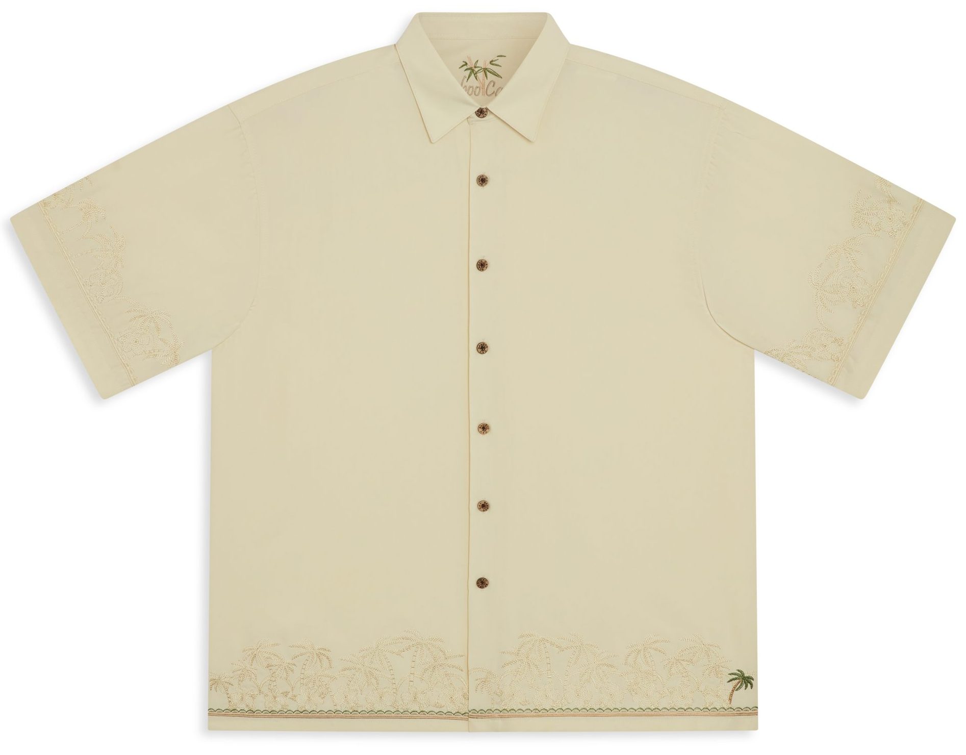 Short-sleeved cream Bamboo Cay embroidered button-up shirt with subtle palm tree designs on the collar, sleeves, and hem, laid flat on a white background.